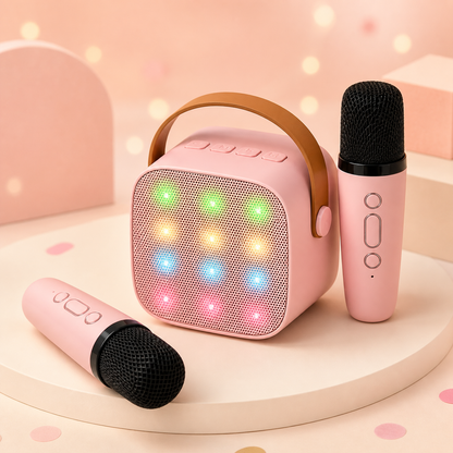 Pink kids karaoke machine with two wireless microphones and twelve colour-changing LED lights