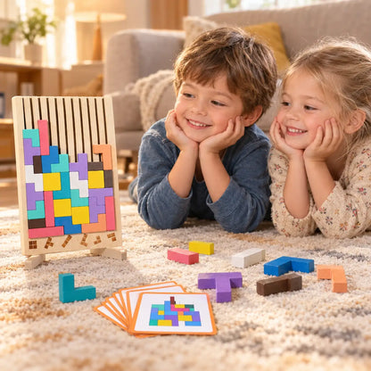 A boy and girl lying on the rug looking at the half-built block puzzle standing beside them