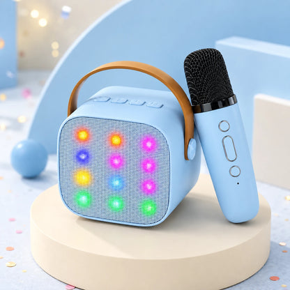 Blue kids karaoke machine with twelve colour-changing LED lights and its matching blue wireless microphone