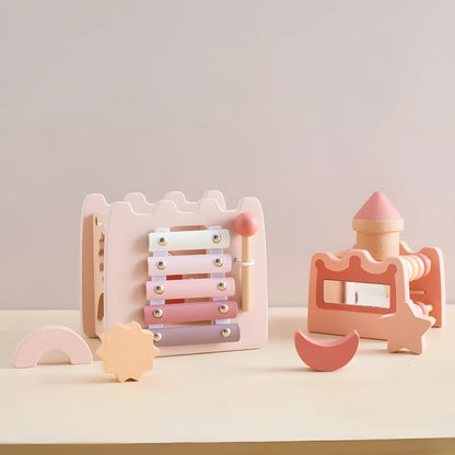 The learning castle from both sides with its four shape pieces, showing the xylophone, mirror, turret and abacus