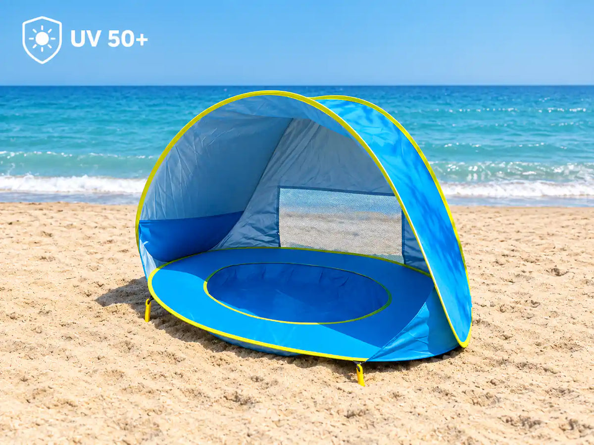 Little Cubs pop up pool tent on beach sand, with a UV 50+ sun protection badge