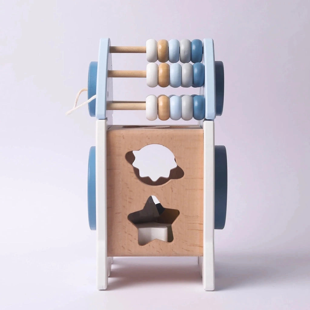 Rear view of the wooden learning rocket showing the three bead counting rails and the cloud and star sorting holes