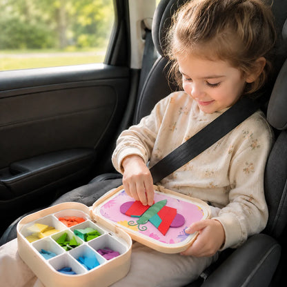 Child using the magnetic mosaic board on their lap during a car journey