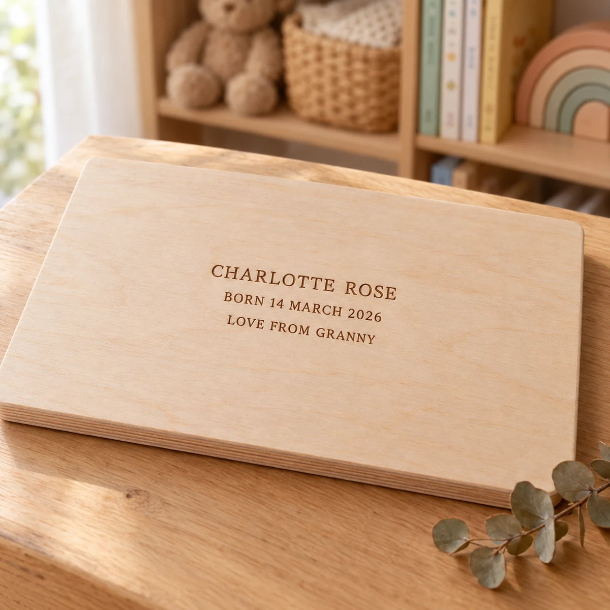 The back of the name puzzle engraved with a name, a birth date and a message