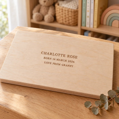 The back of the name puzzle engraved with a name, a birth date and a message
