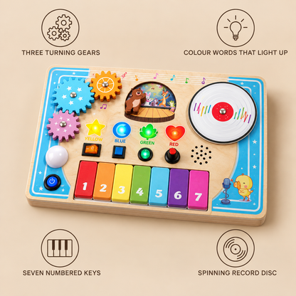 Piano busy board features: three turning gears, colour words that light up, seven numbered keys, spinning record disc