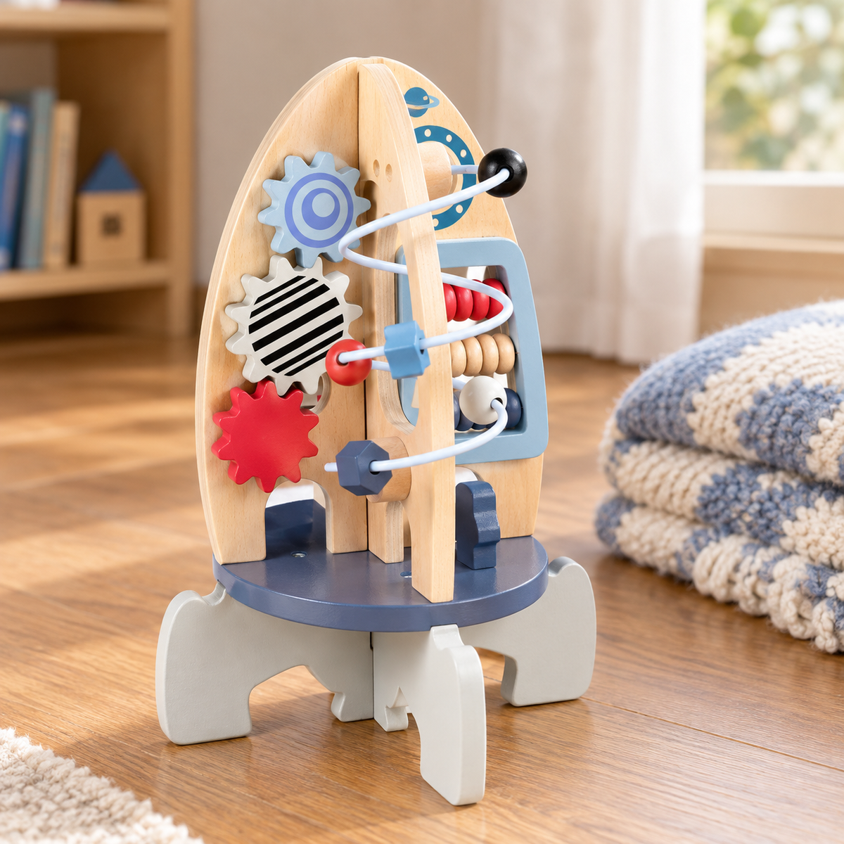 Wooden rocket activity centre showing its gears, bead maze and counting beads