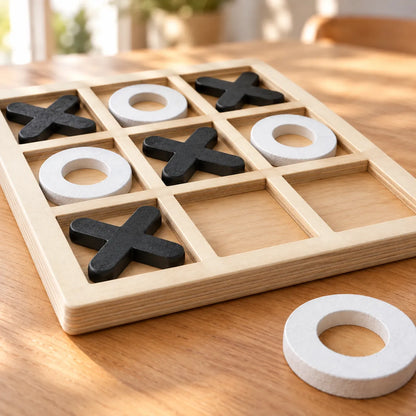 Close-up of the chunky wooden X and O pieces sitting down into the board's nine recesses